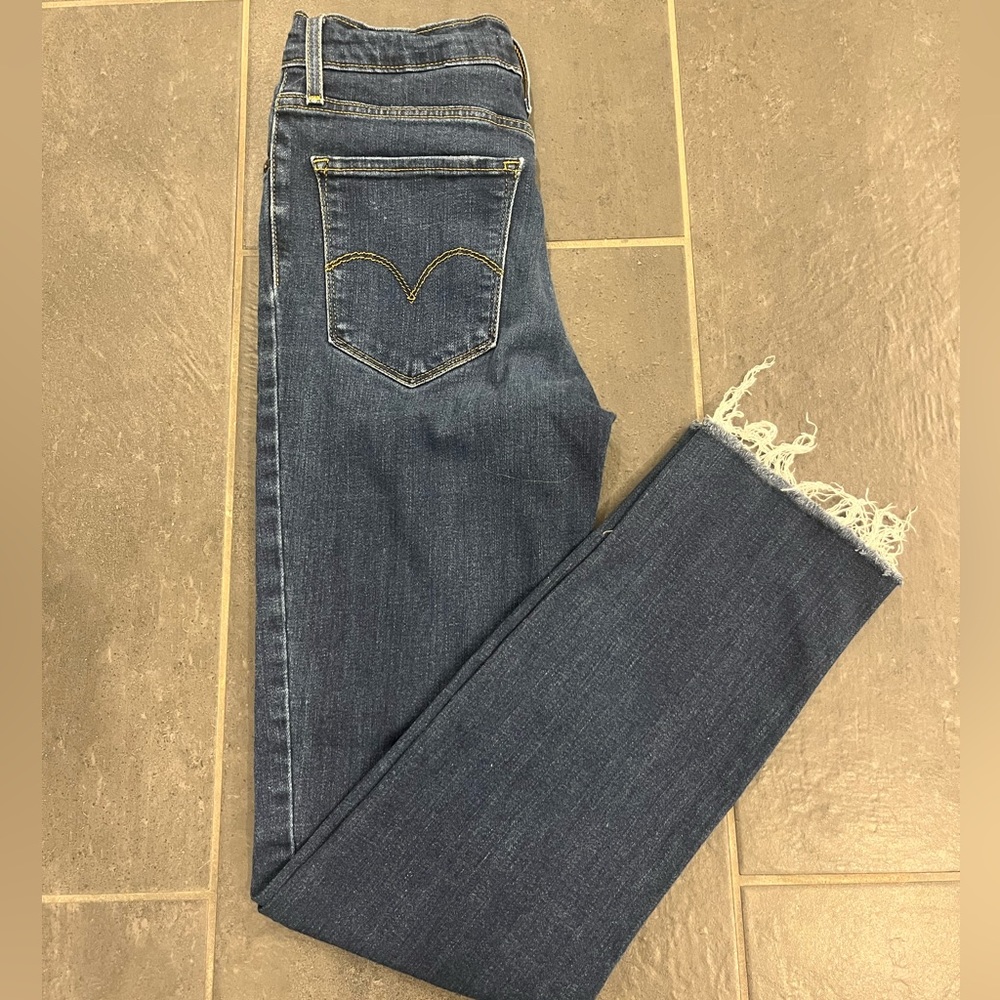 Dark wash Levi's high rise straight leg jeans with frayed hem